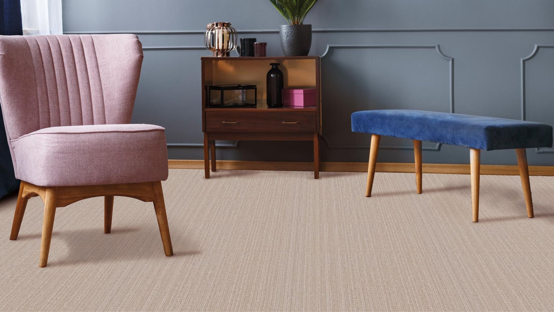 beige textured carpets in a stylish living room with pink chair and blue accent wall